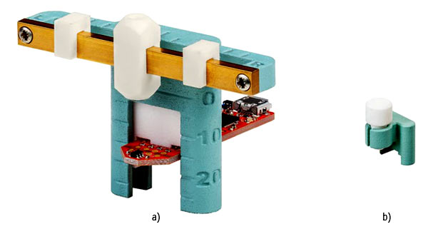 Линейный привод (а) и поворотный переключатель (б) для оценочного комплекта 3D Magnetic Sensor 2 Go